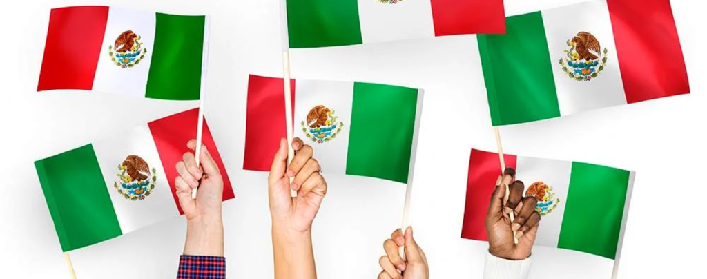 Hands holding Mexican flags celebrating their Mexican nationality